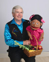 Mr. T, the Jamila puppet, and a basket of vegetables
