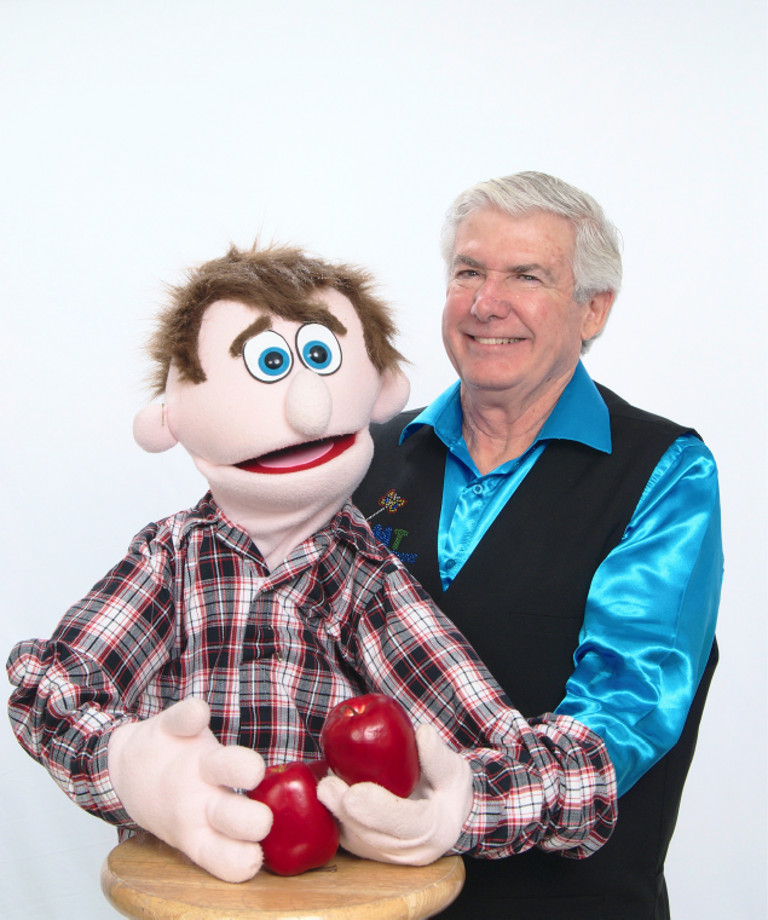 Mr. T and his puppet holding two apples
