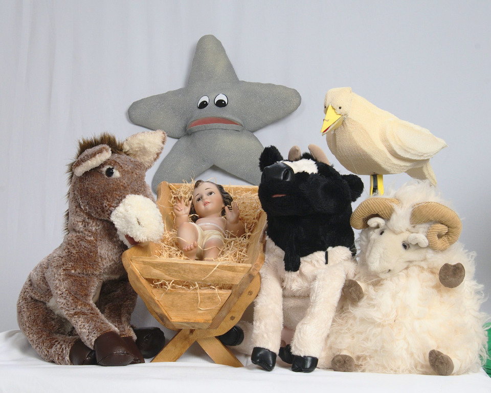 The puppets sitting around the manger